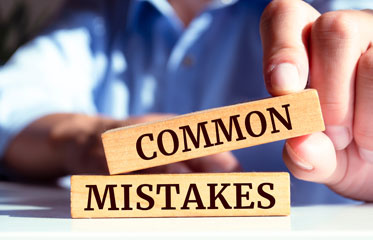 Avoid critical post-arrest mistakes in Madison County, AL—wooden blocks symbolize common errors.