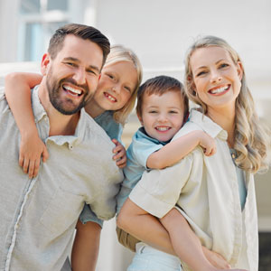 Happy family portrait illustrating the benefits of sound family law and estate planning.